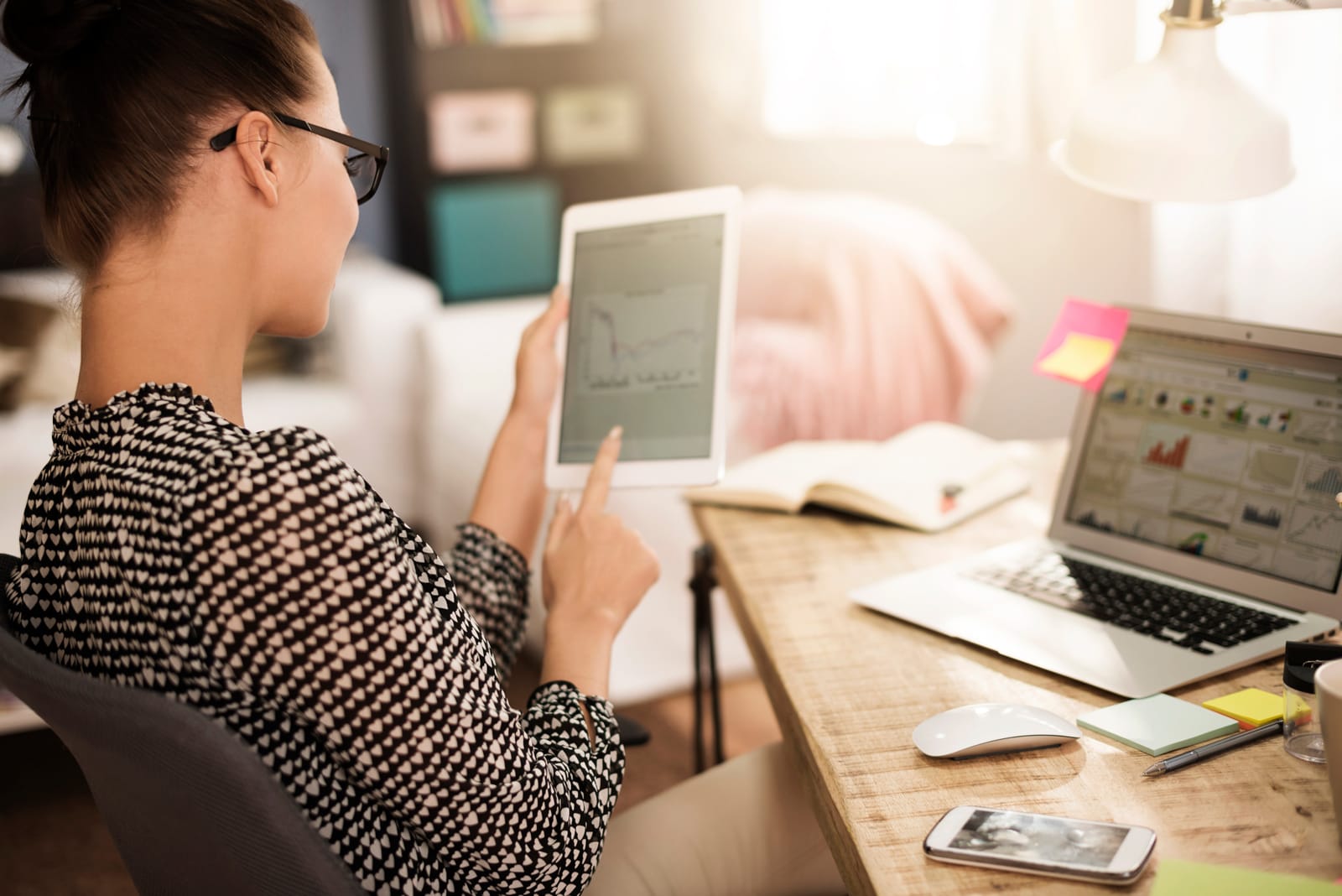 woman on ipad looking at portfolio